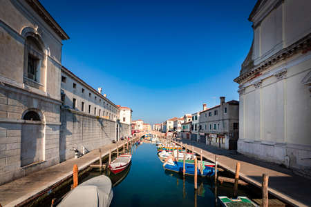 Romantic cityscape of Ghioggia - near Venice - with canals, buidings, bridges and canals in Daylight. Philippine Bridgeの写真素材