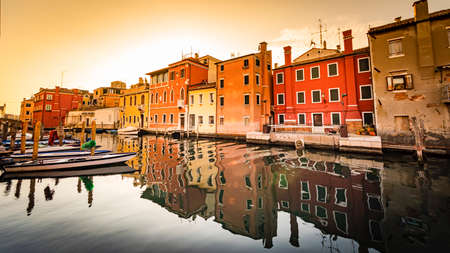 Romantic cityscape of Ghioggia - near Venice - with canals, buidings, bridges and canals in sunset sunlight. Bridge of Vicoの写真素材