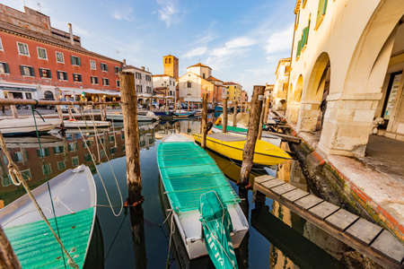 Romantic cityscape of Ghioggia - near Venice - with canals, buidings, bridges and canals in sunset sunlight. Bridge of Vicoの写真素材
