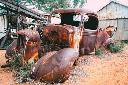 Old car wrecks, with damage, dents and completely rusty. Concept of needing a new car.の写真素材