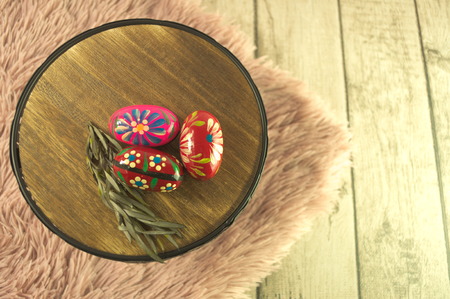 colored Easter eggs on the tableの写真素材