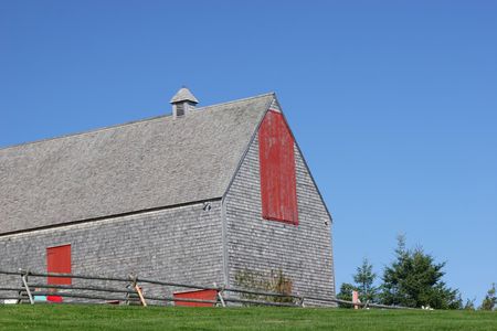 A large barn typical of the early 1900's in the Cavandish National Park, Prince Edward Island, Canadaの写真素材