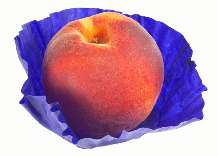 Single peach in its blue packaging paper.の写真素材
