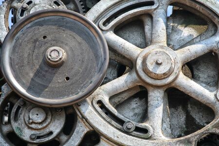 Detail of of an old grungy piece of industrial machinery used in a manufacturing process.の写真素材