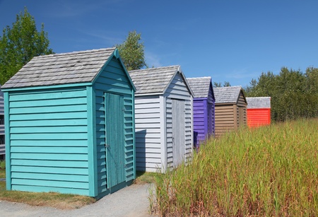 A row of brightly colored small garden sheds.の写真素材