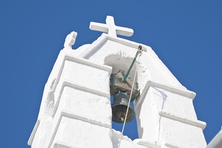 Bell in a bell tower of a classic Greek Church on the island of Mykonos.