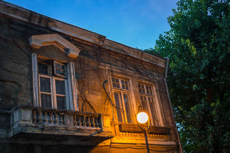 Street lantern on an old house facadeの写真素材