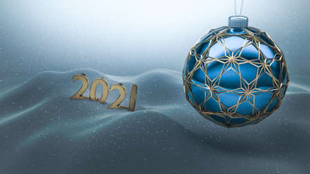 One blue christmas ball enclosed with gold ornaments hanging over snow ground. Year number 2021 made of gold standing on the snow in the background.  Happy new year 2021, merry christmas card.の写真素材
