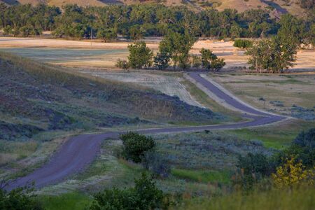 A twisting country road on a farm on the Canadian Prairieの写真素材
