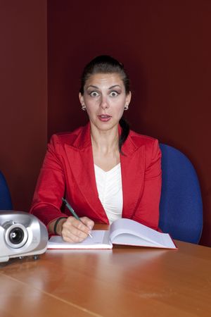 A female office worker taking notesの写真素材