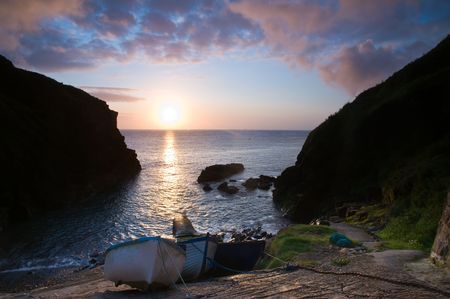 Three small boats laid up on the slipway in a small Cornish fishing village.