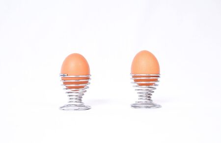 Two boiled eggs in modern spiral eggcups.の写真素材