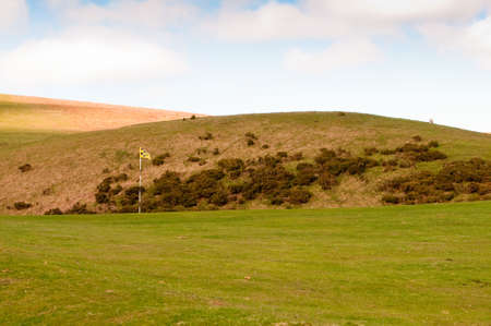 The green flag on a moorland golf coarse in the UK.の写真素材