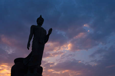 Silhouette buddha sculpture in blessing poseの写真素材