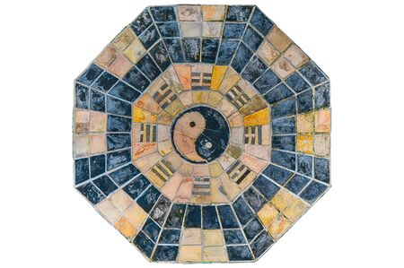 Old and grunge yin-yang and fengshui symbol made with intensionally cut stone tilesの写真素材