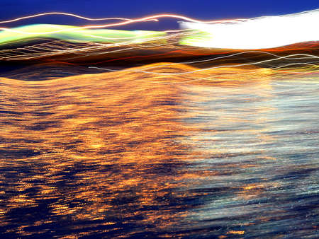 Abstract and ripple flow of light path and reflection on the move at nightの写真素材
