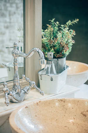 Bathroom interior with sink and faucet. A cozy, fresh and clean modern bathroom Vintage bathroomの写真素材