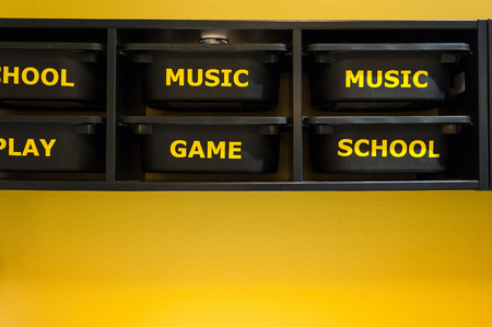 Pretty toys shelf storage in a young boys bedroom.Toys shelf storage, school, music, game, play.の写真素材