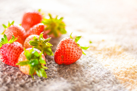 Fresh strawberries on the table with high key scene.の写真素材