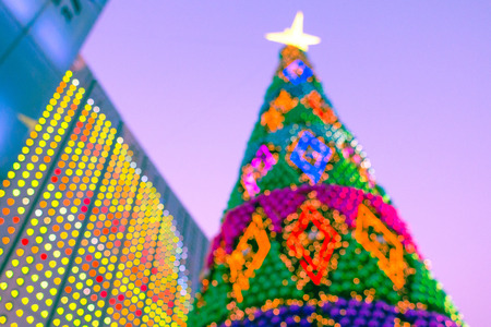 Blurred background of decorated glowing Christmas tree and fireplace.
Christmas background with unfocused Christmas tree.
Night illumination of Christmas and New Year celebration in colorful pastel.の写真素材