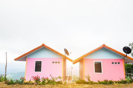 Wooden couple cottage in the top of the misty mountain, Phutabberk, Phetchabun, Thailand.