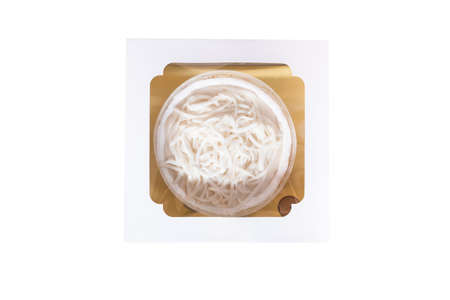 The coconut cake with coconut meat layer on topping isolated on white background.Homemade coconut fresh cream cake in cake box package, Thai dessert.1 pound of Coconut fresh & white cream cake.の写真素材