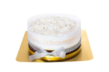 The coconut cake with coconut meat layer on topping isolated on white background.Homemade coconut...