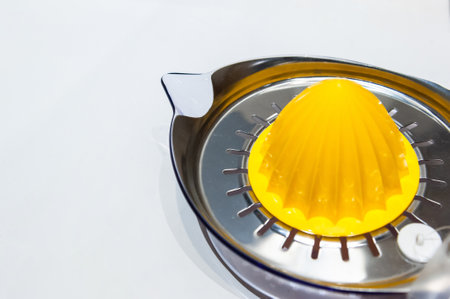 Orange juice squeezer isolated on white background.
Stainless steel orange squeezer close up on white background.の写真素材