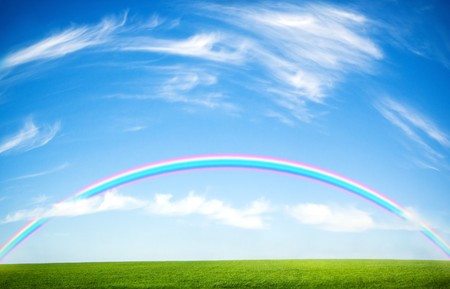 background of cloudy sky and rainbowの写真素材