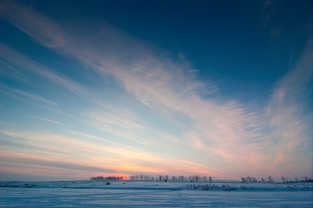 a winter landscape at sunsetの写真素材