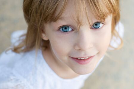 Little girl with blue eyesの写真素材