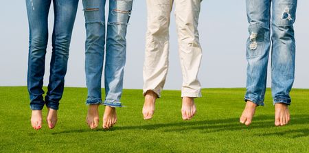people wearing jeans and jumping
