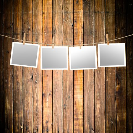 blank paper sheets on a clothes lineの写真素材