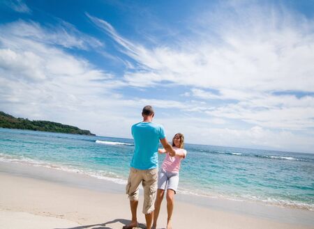 couple having fun at seasideの写真素材