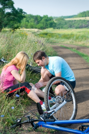 woman was falled off bicyleの写真素材