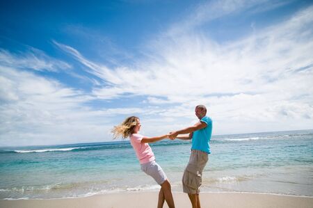 couple having fun at seasideの写真素材
