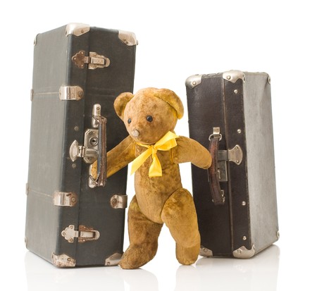 old teddy bear with suitcasesの写真素材