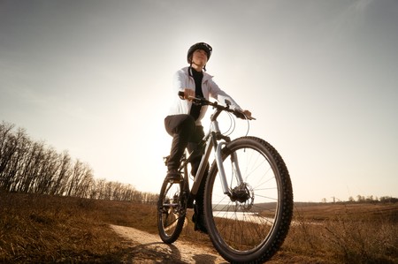 girl relax biking in autumn meadowの写真素材