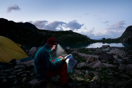 a man hiking at nightの写真素材