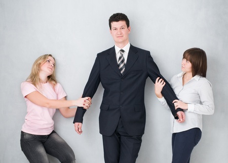 man and two his girlfriendsの写真素材