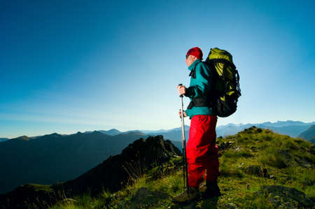 man hiking in mountain with backpackの写真素材