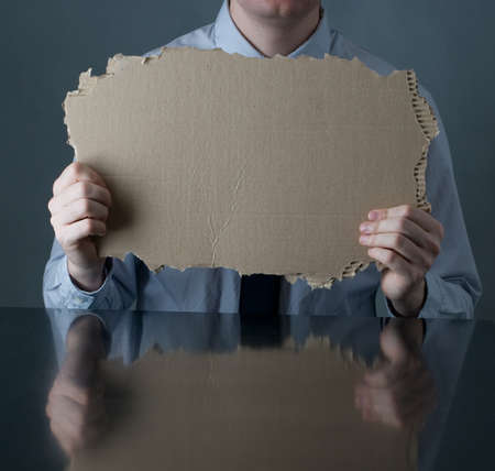businessman sitting on table with blank paperの写真素材