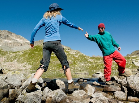 man helping hand to womanの写真素材