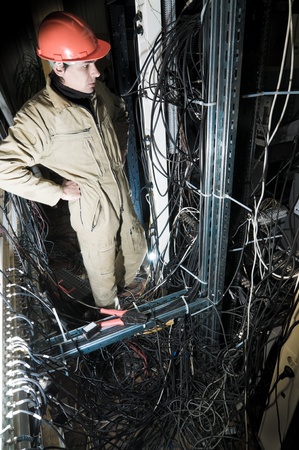 technician working on cables and wires