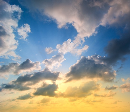 cloudy sunset with many sun beamsの写真素材