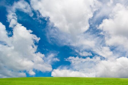 background of cloudy sky and grassの写真素材