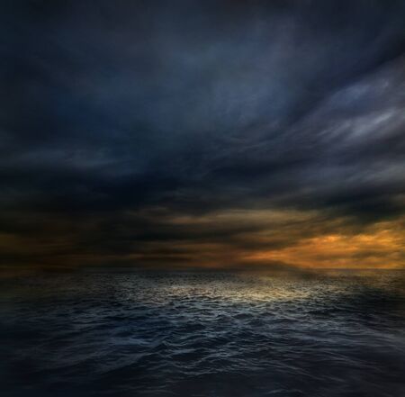 Dark stormy clouds over the oceanの写真素材