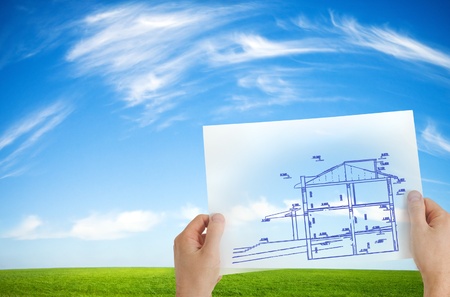 new house outline over idyllic backgroundの写真素材