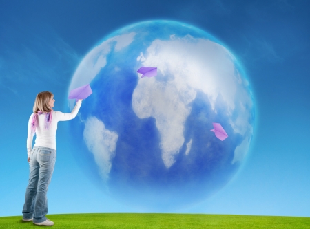 a woman with paper planesの写真素材