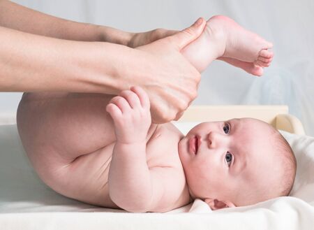 a doctor massaging little babyの写真素材